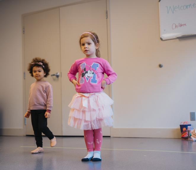 Two girls wearing pink at dance class