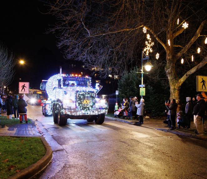 lit up truck with christmas lights in a parade