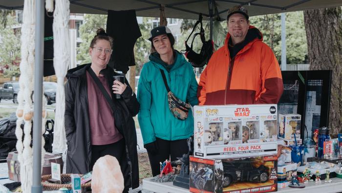 People selling items at garage sale