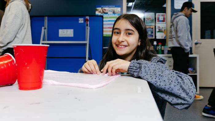 Youth at a table in the youth centre