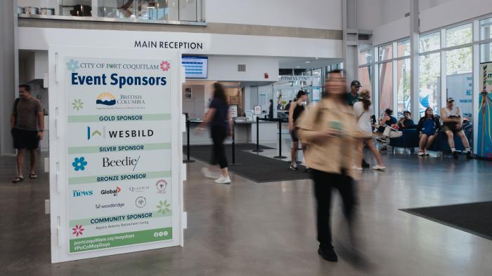 Signage with event sponsors listed, at an event inside the recreation centre