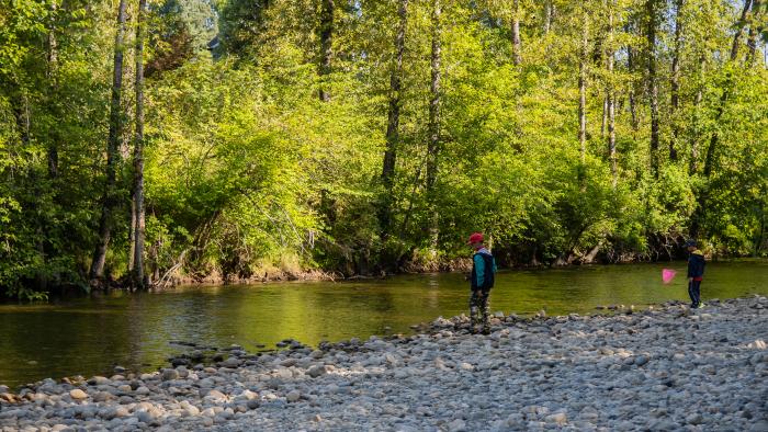 Kids fishing by river