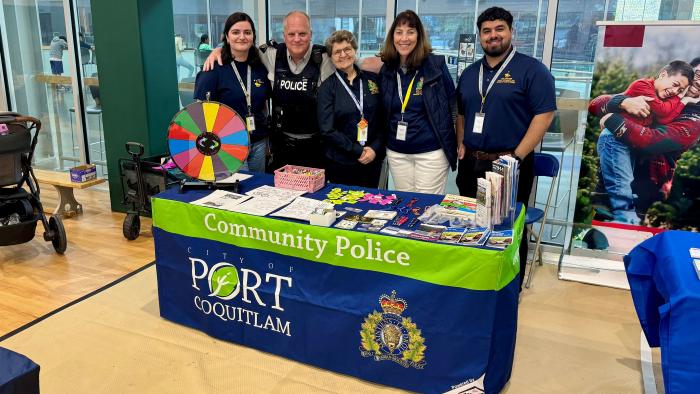 Port Coquitlam Community Policing Volunteers at a community table