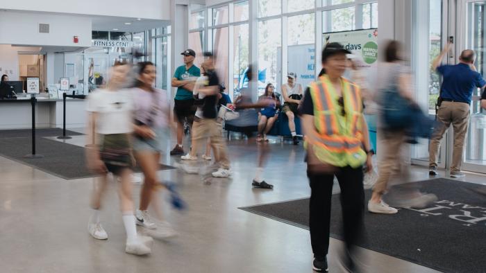 people walking through port coquitlam community centre