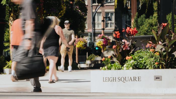 People walking through Leigh Square