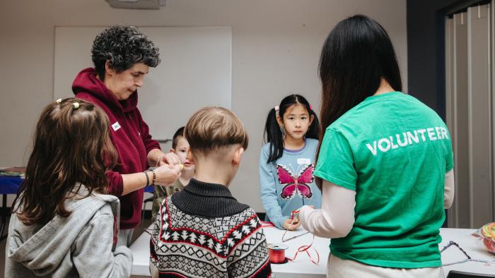 volunteering working on crafts with kids