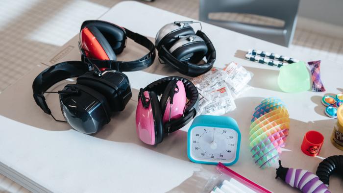 headphones and sensory tools on table