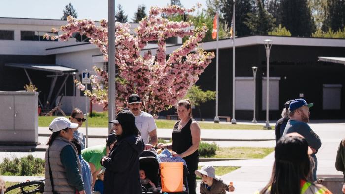 Public Works staff at school with family in background