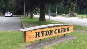 Hide Creek Recreation Centre signage. The sign is wooden with dark lettering.