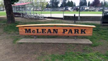 McLean Park signage. The sign is wooden with dark lettering.