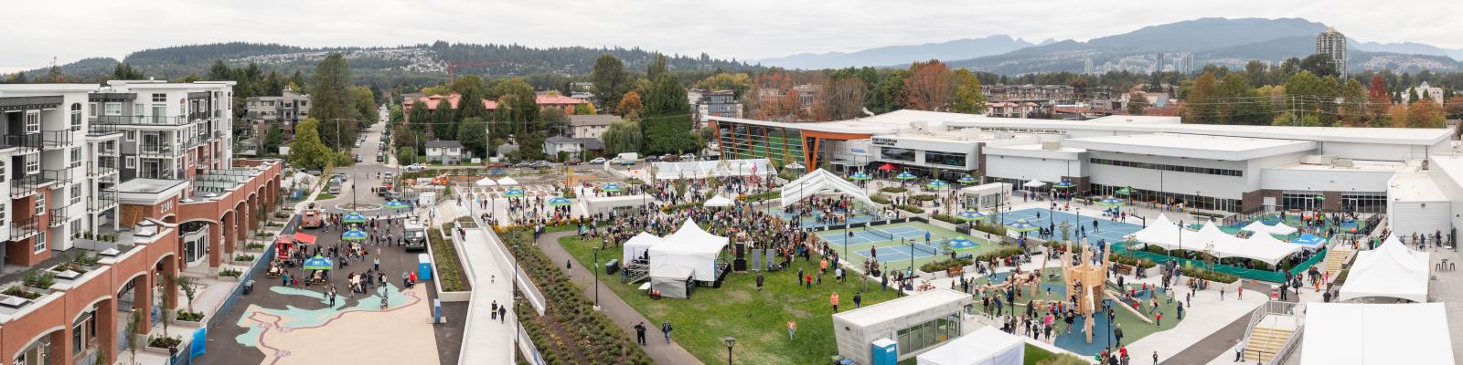 Aerial view of Port Coquitlam Community Centre courtyard area with people attending an event