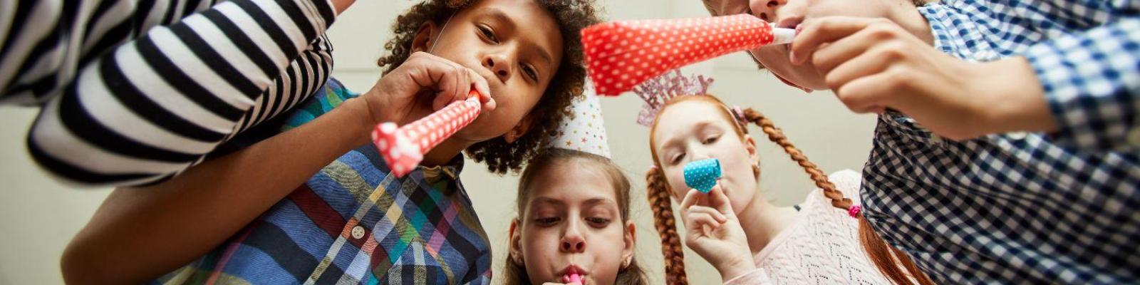 Children wearing birthday hats