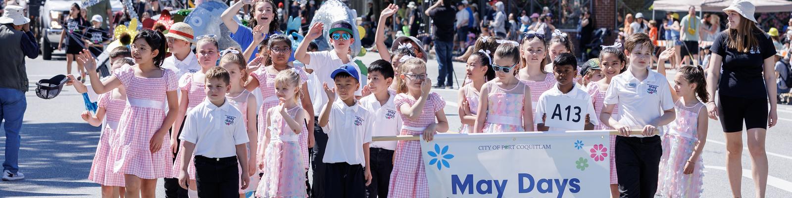 May Days Royal Party walking in the parade in downtown Port Coquitlam