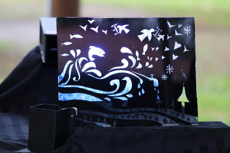 A screen with an ocean scene on it that's backlit