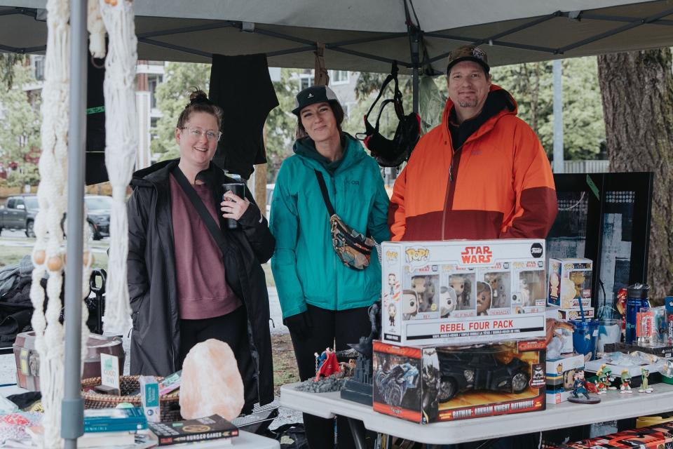 Garage sale sellers at their booth