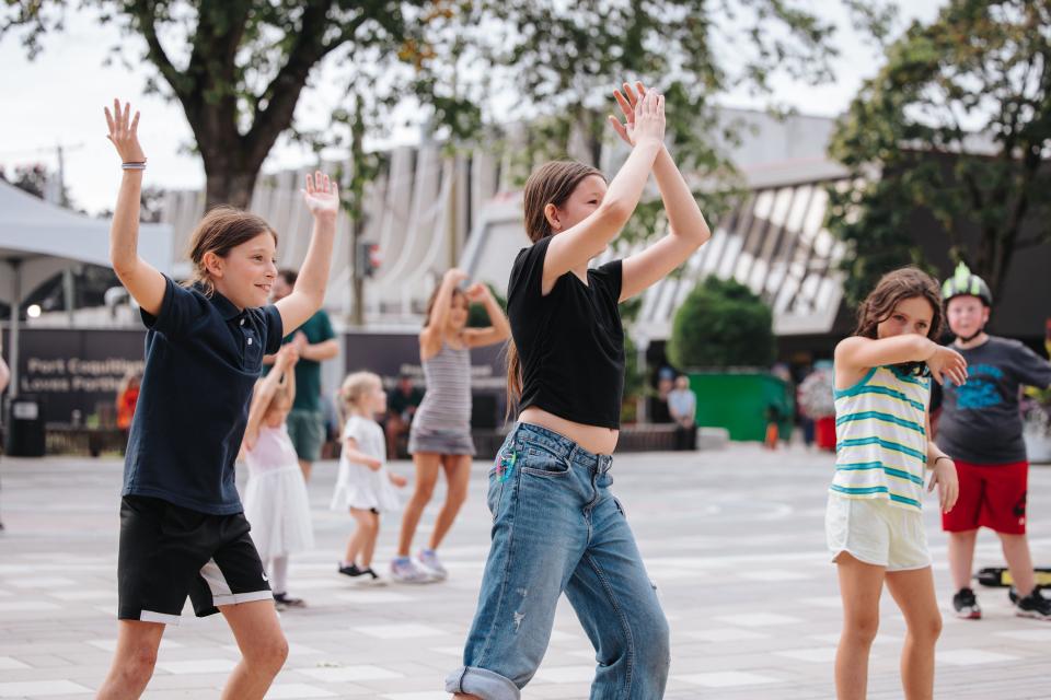 kids following dance steps in Leigh Square