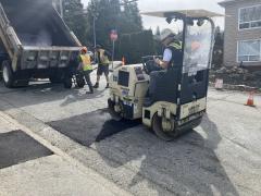City workers repairing a pothole