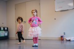 Two girls wearing pink at dance class