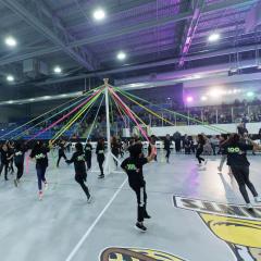 Kids dancing with rainbow ribbons