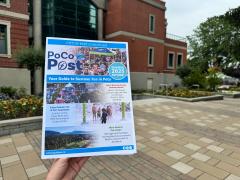 PoCo Post newspaper held up in front of City Hall
