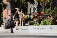 People walking through Leigh Square