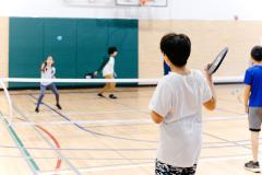kids playing pickleball in gymnasium