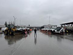mayor with snow and ice removal trucks