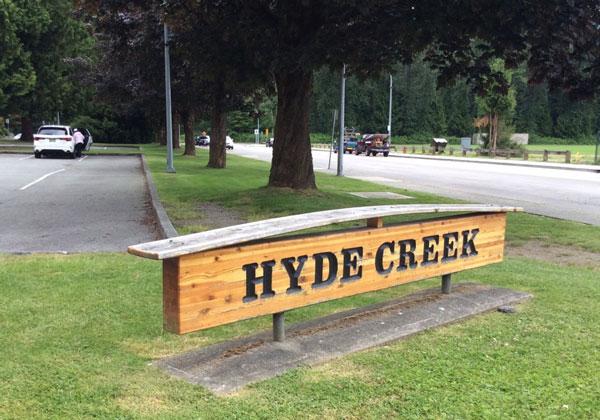 Hide Creek Recreation Centre signage. The sign is wooden with dark lettering.