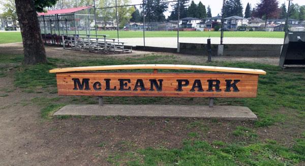 McLean Park signage. The sign is wooden with dark lettering.