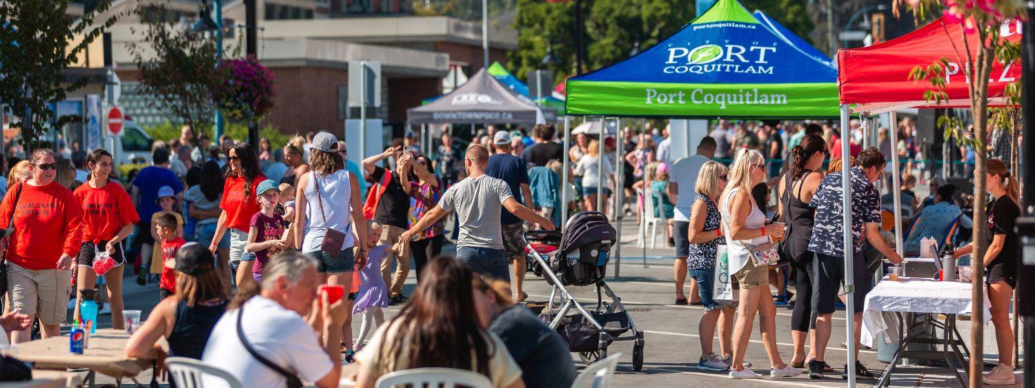 People wandering through a public fair