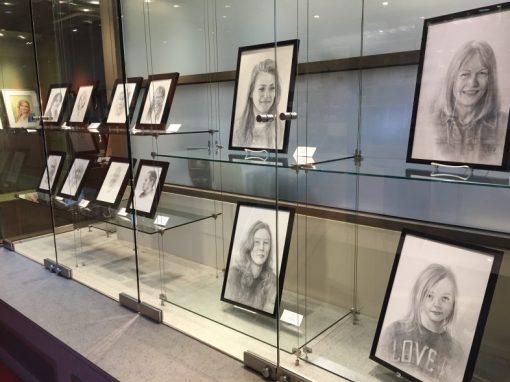 Display cases containing different pieces or art.