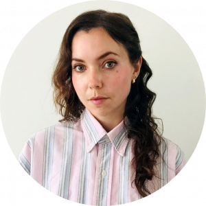 Headshot of Keely O'Brien. There is a woman with long hair wearing a pastel-coloured long sleeve shirt.