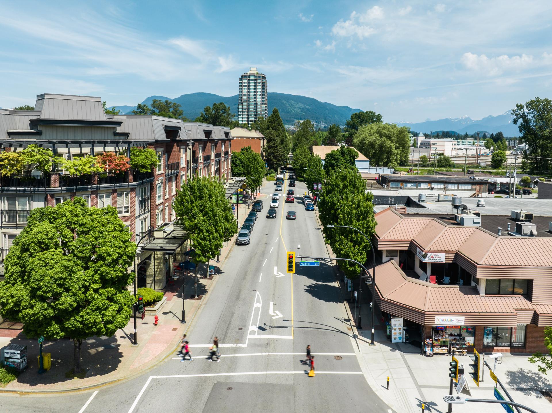 Aerial photo of Shaughnessy St in downtown Port Coquitlam, with street, crosswalks, trees and businesses