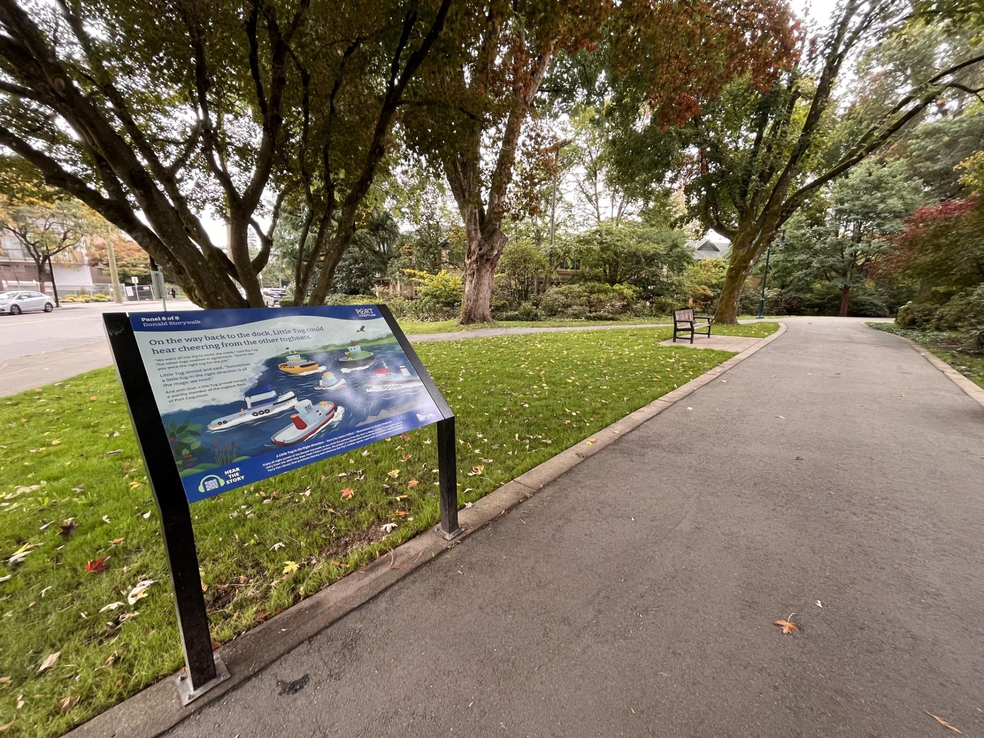 Panel along a pathway with a short story and illustration written on it