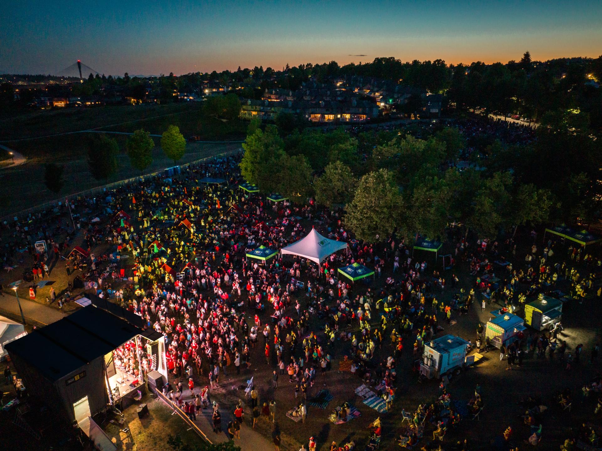 Canada Day at Castle Park from above, crowd watching performance after dark
