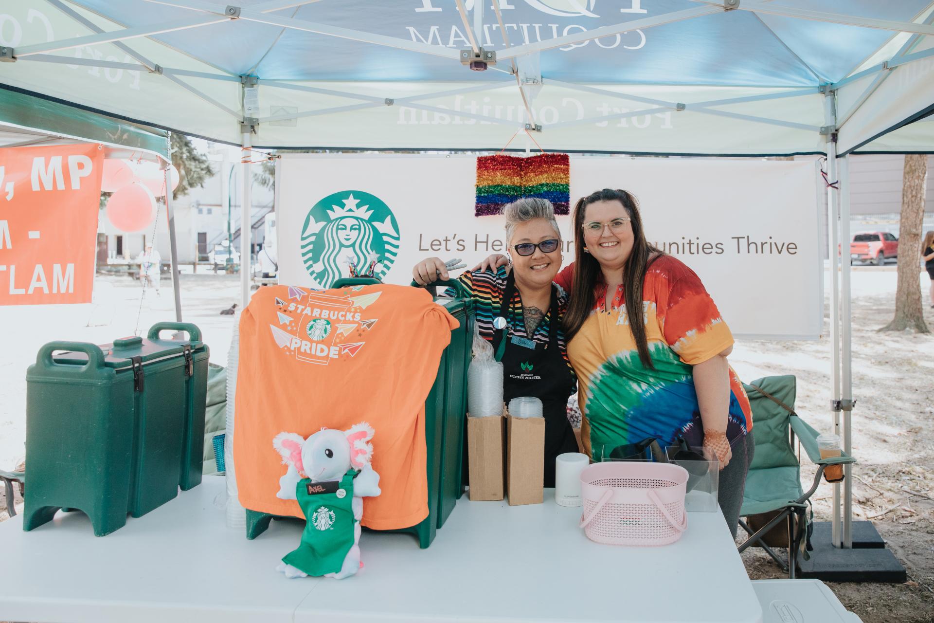 Two people under information tent