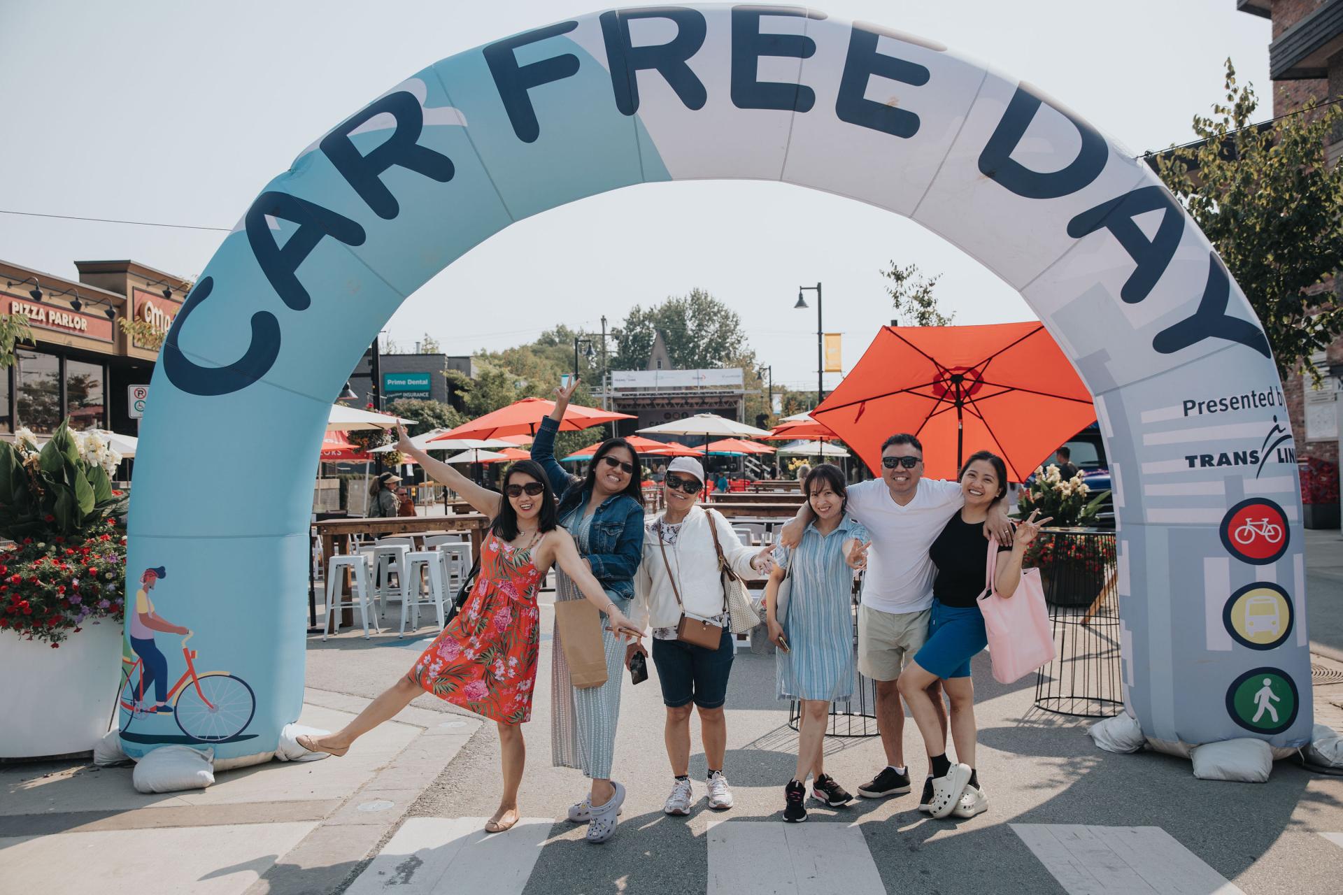 car free day arch with people underneath