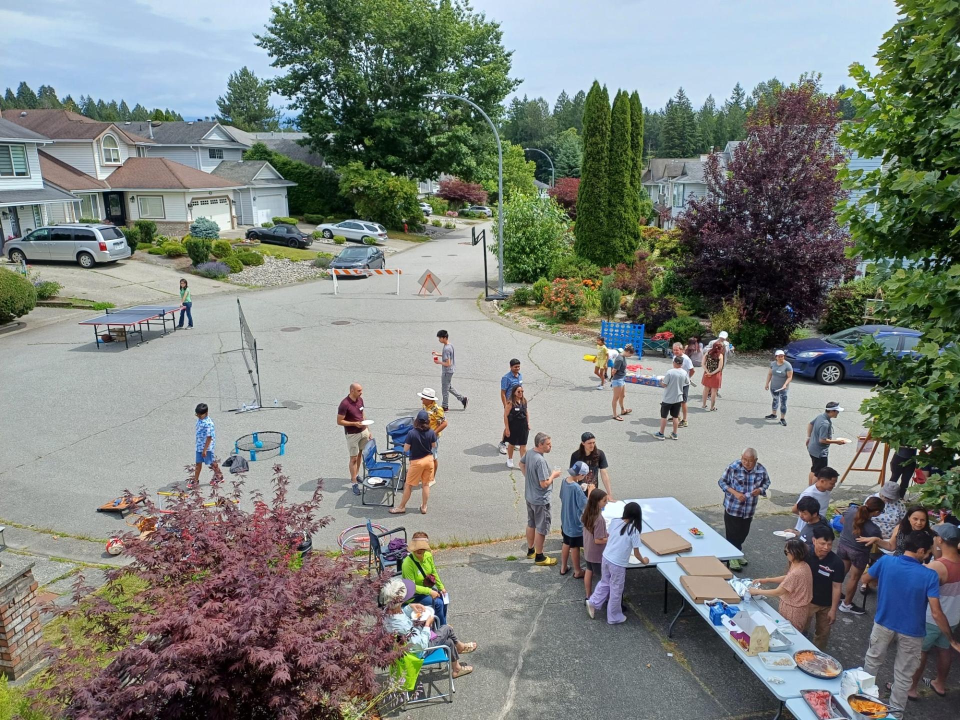 people on street having a block party