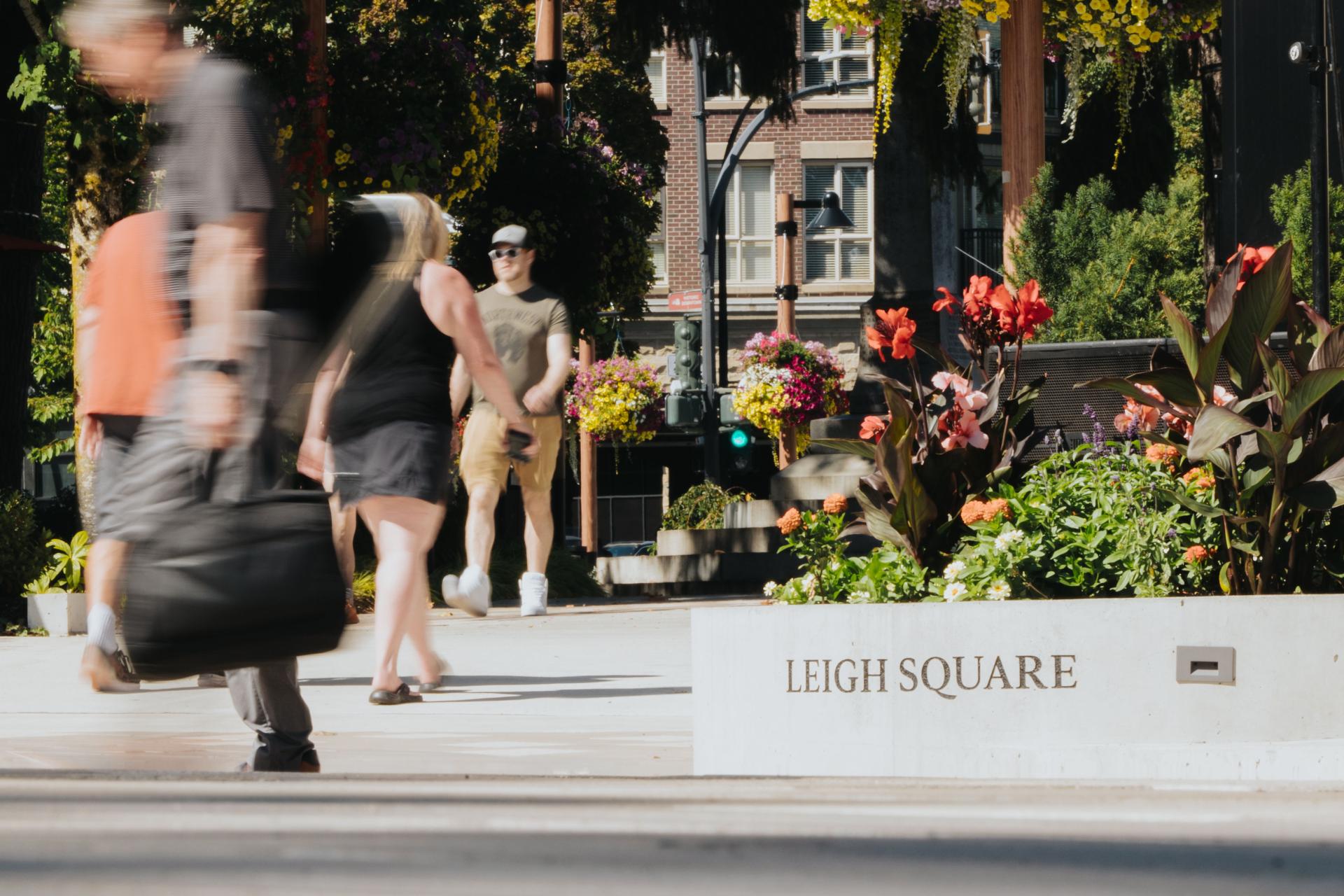 People walking through Leigh Square