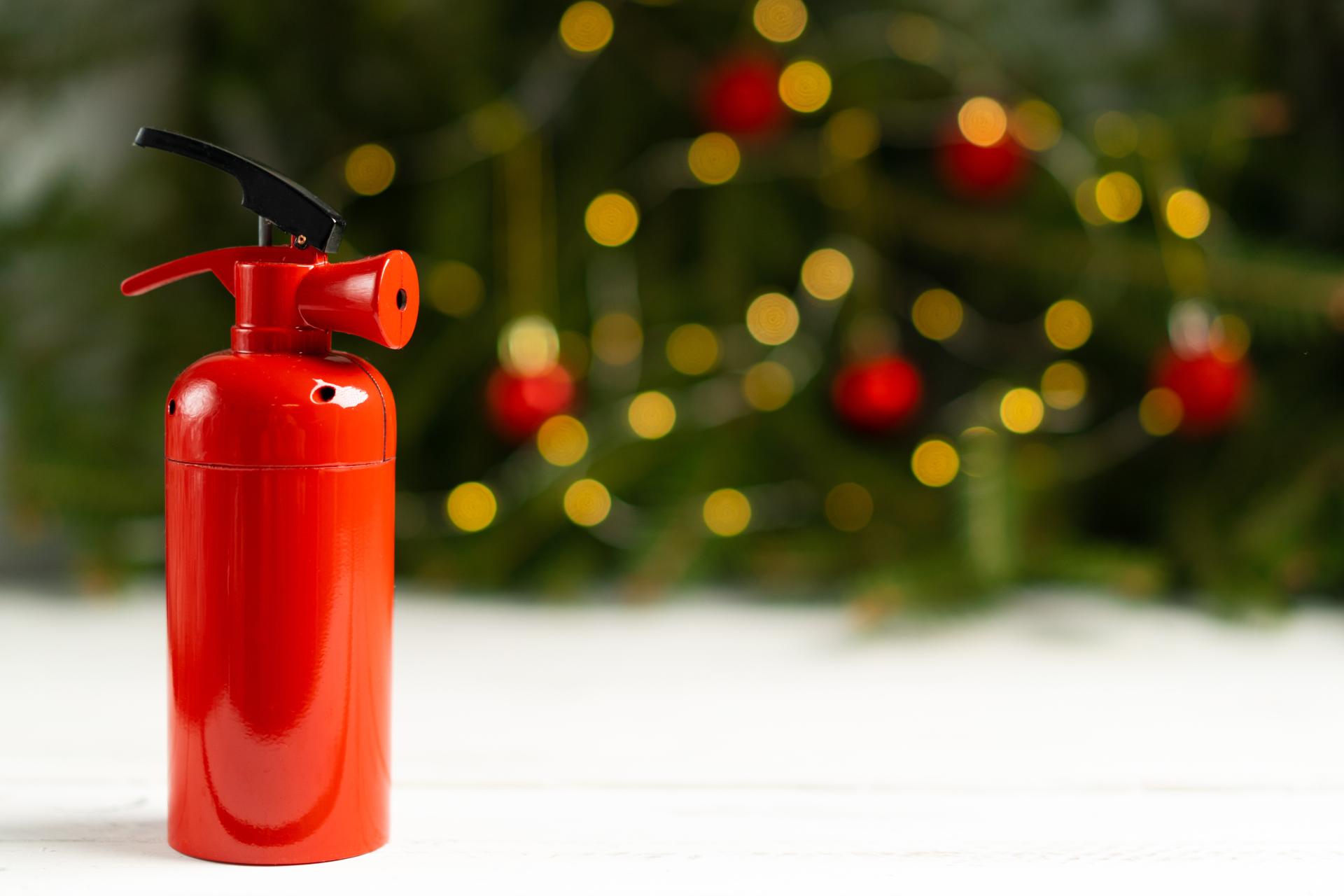 fire extinguisher with christmas in background