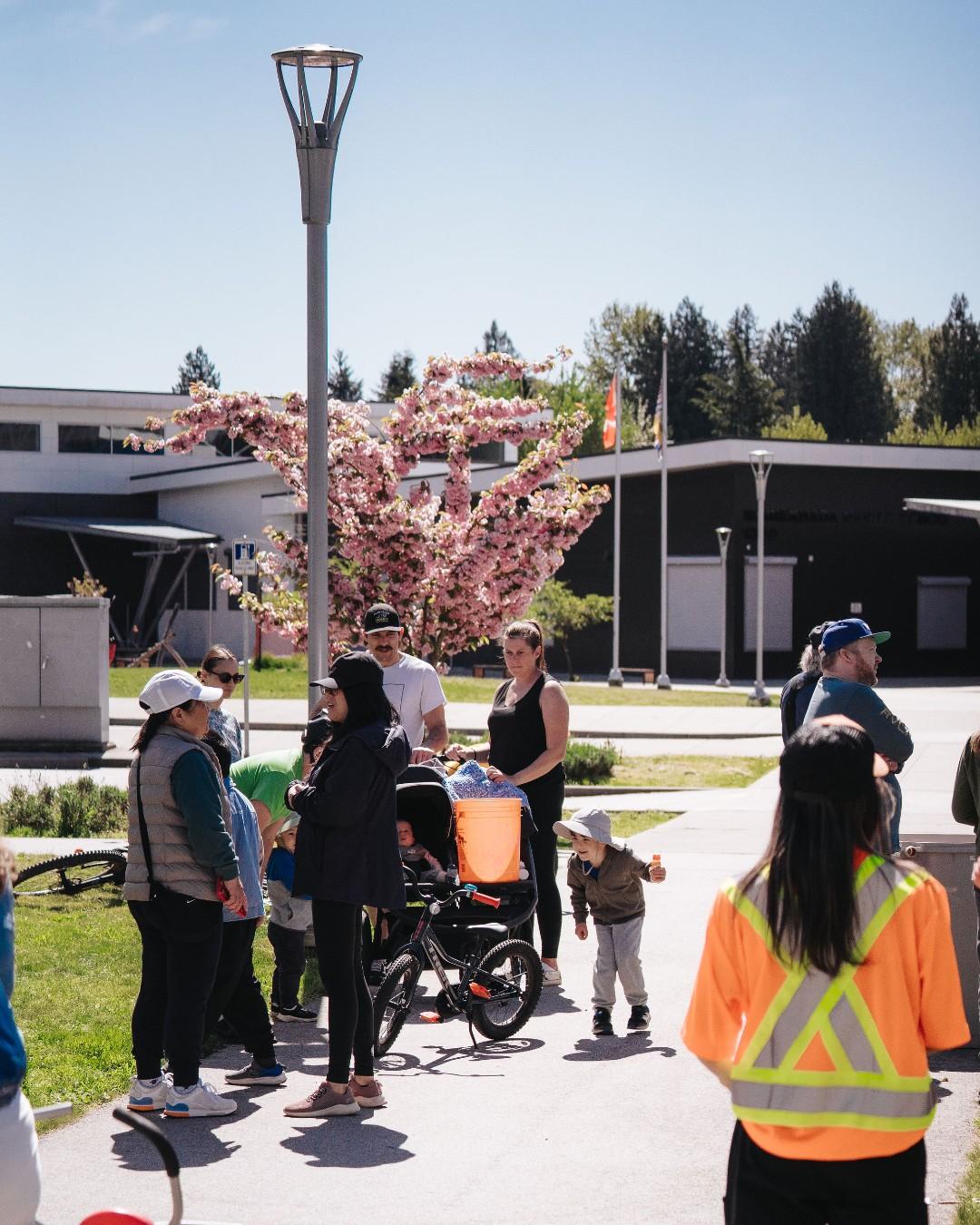 Public Works staff at school with family in background